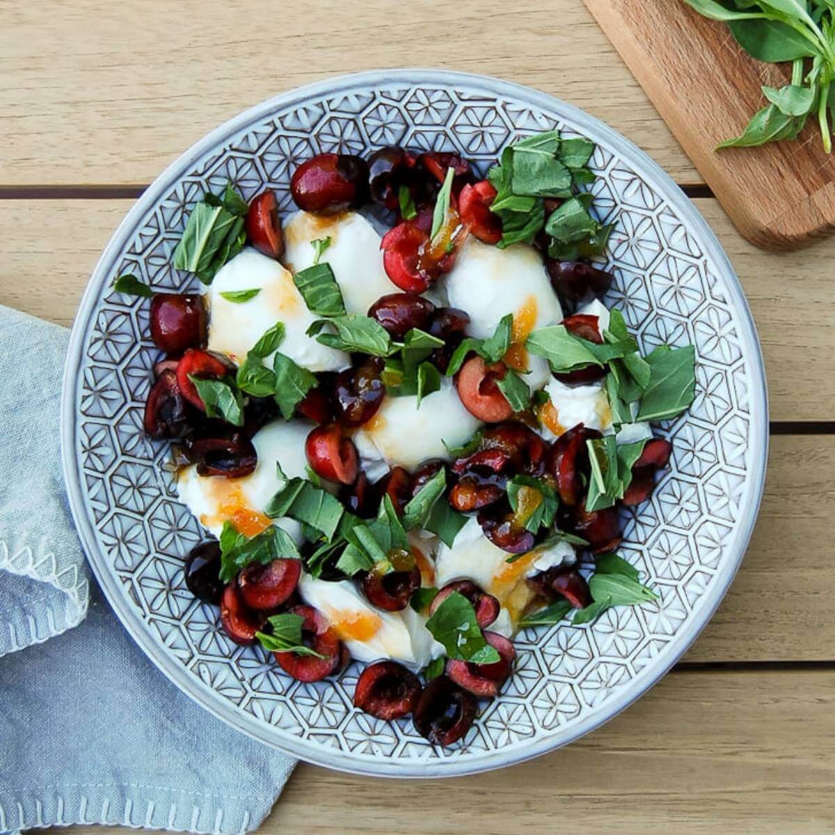 Burrata Cheese Accompanied by Crushed Cherries and Pistachios