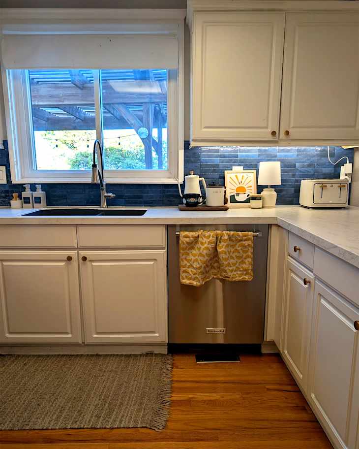 Sun themed art print on countertop of newly renovated kitchen.