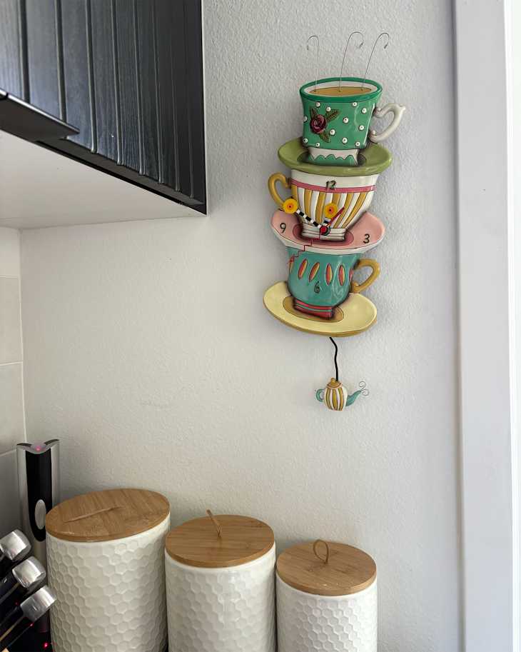 Colorful saucer trinket on kitchen wall.