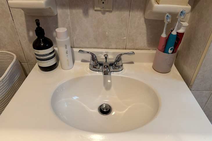 Toiletries on bathroom vanity.