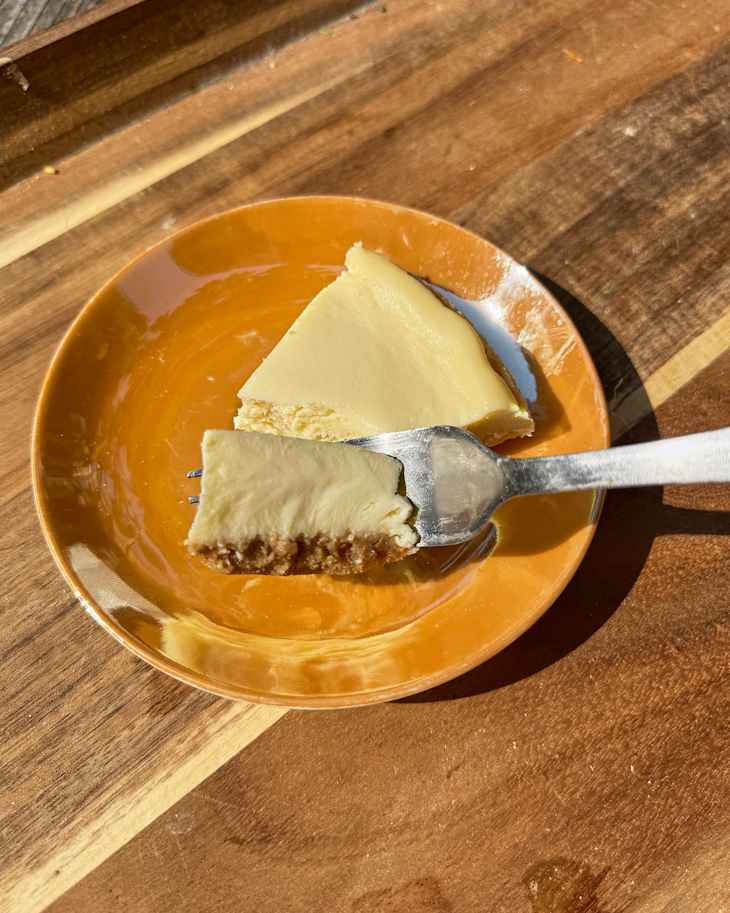 Philadelphia Original Cheesecake slice on plate with one bite on fork