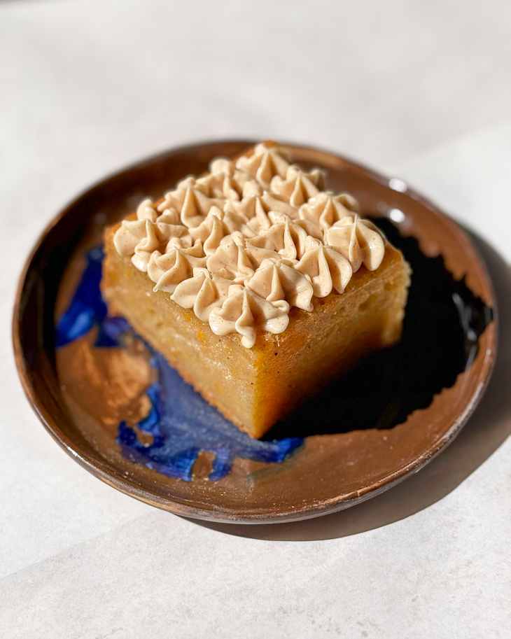 Slice of cake with Philadelphia Original Cheesecake frosting on top