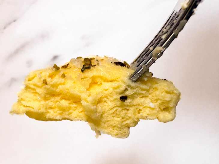 Mayonnaise microwave eggs on fork.