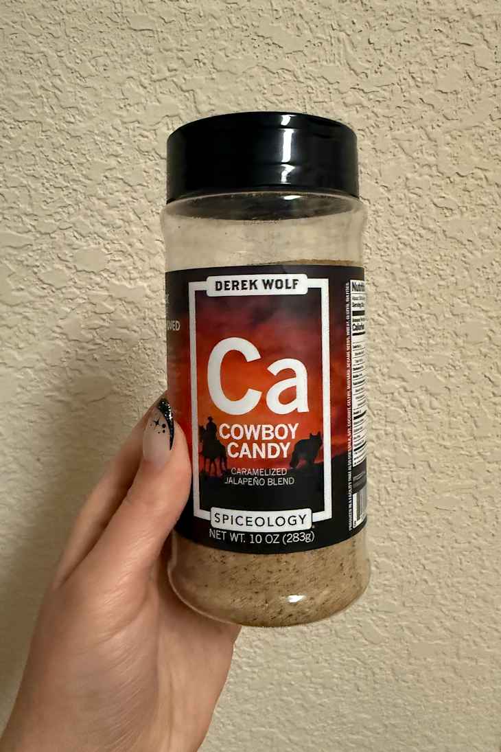 Container of Cowboy Candy seasoning blend held.