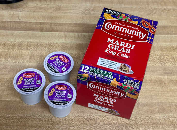 Community Coffee Mardi Gras King Cake K cup pods next to box on counter