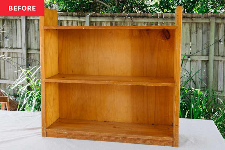 Wooden bookshelf before redecorating.