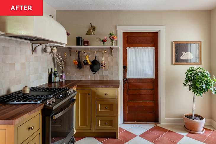 Renovated kitchen with deep mustard cabinets and pearled backsplash