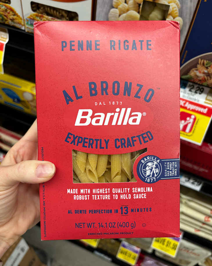 Someone holding box of Barilla pasta.