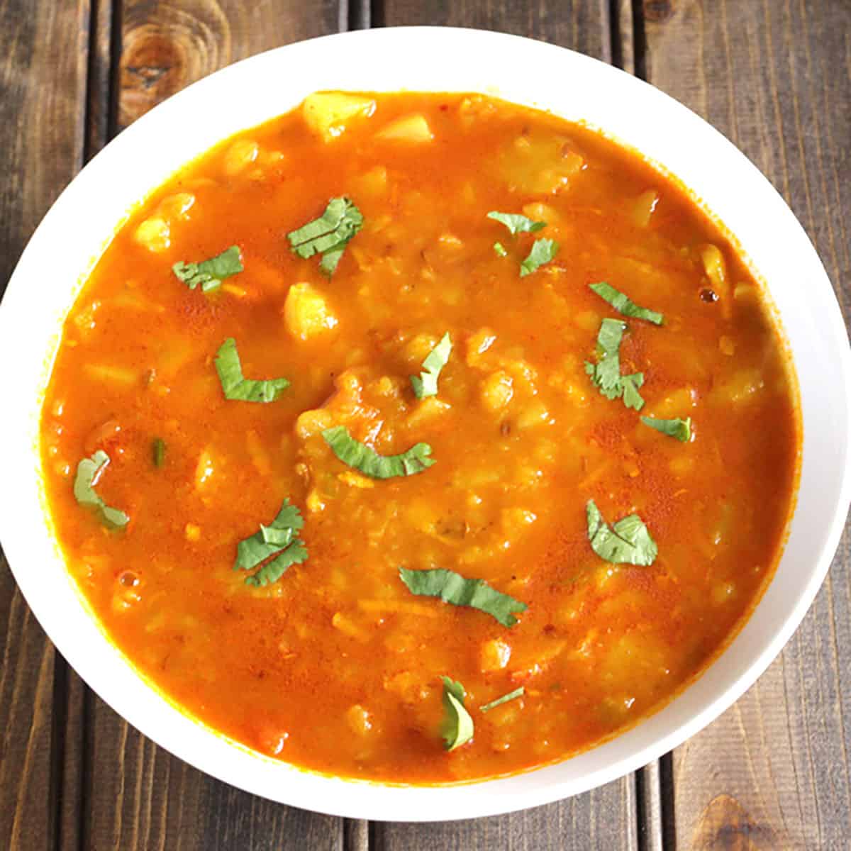 Aloo Rasedar: A Recipe for Potato Curry Excluding Onion and Garlic