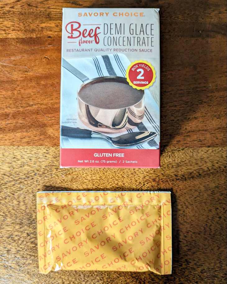 Savory Choice beef demi glace concentrate on countertop.