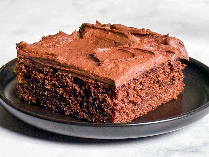 Plated slice of coca cola cake.