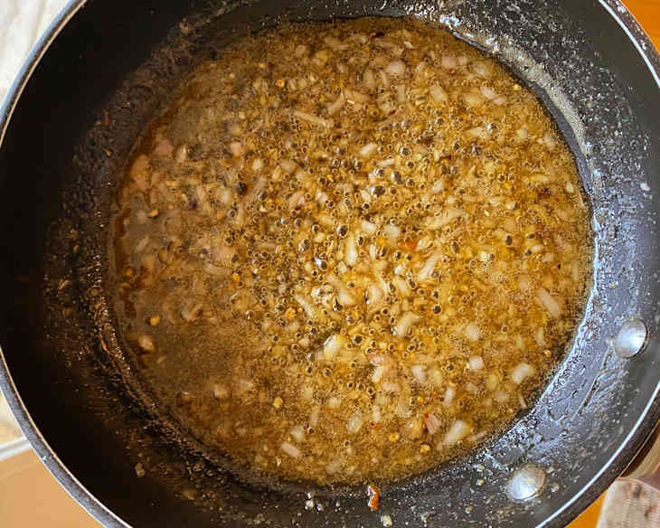 Shallots frying in skillet.