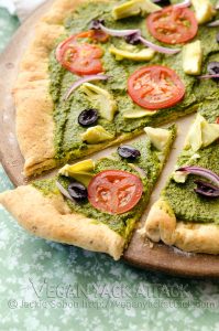 Pizza topped with Pesto Sauce