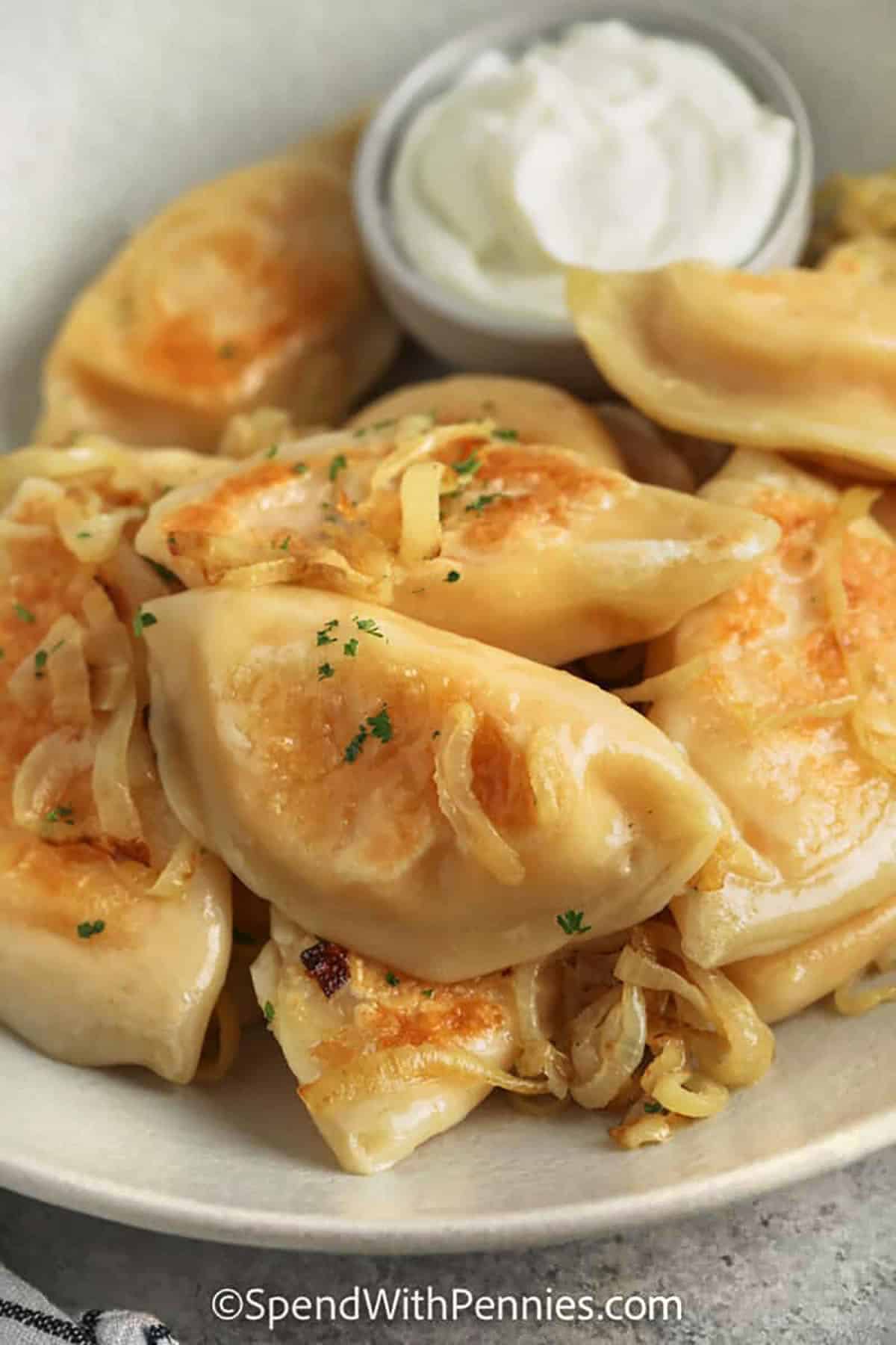 Homemade Pierogi Garnished with Buttery Onions