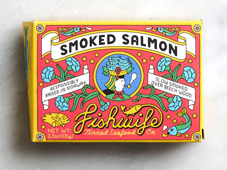 Colorful packaging for smoked salmon featuring illustrations of fish, flowers, and text about sourcing and preparation.