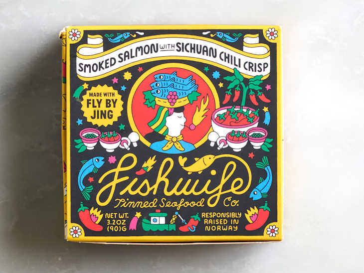 Colorful packaging for Fishwife smoked salmon with Sichuan chili crisp, featuring illustrations of fish, chili peppers, and bowls.