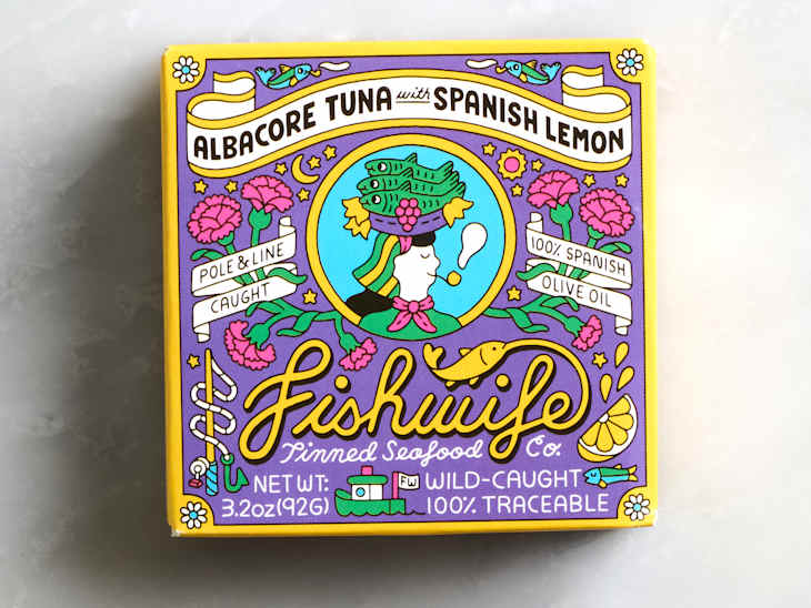 Colorful packaging for albacore tuna with Spanish lemon, featuring floral designs and text about sourcing and ingredients.