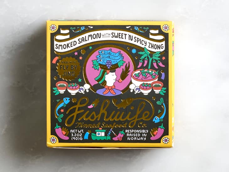 Colorful packaging for smoked salmon with sweet and spicy zhong, featuring illustrations of fish, peppers, and bowls.