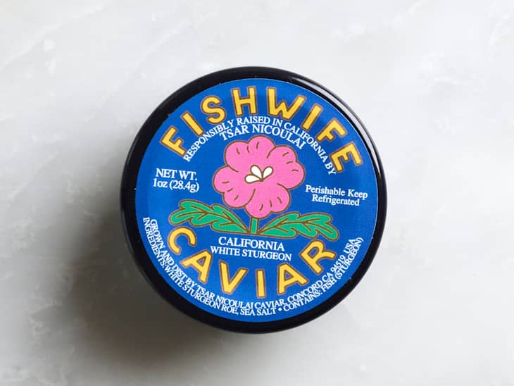 Caviar container labeled "Fishwife" with a pink flower design, indicating California white sturgeon.