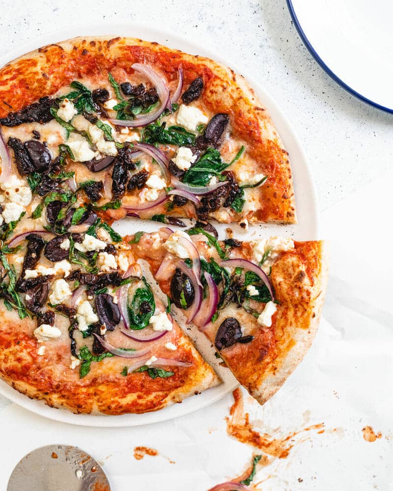 Pizza topped with Mediterranean ingredients