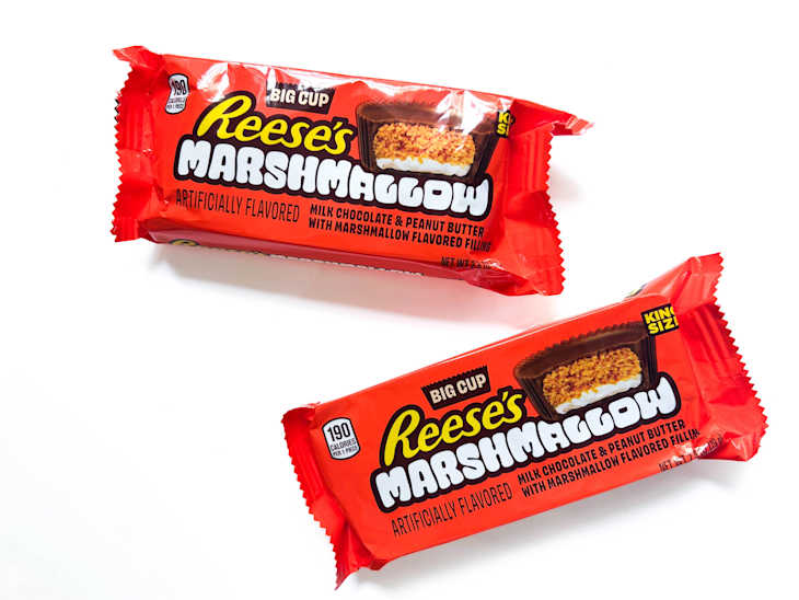 Two packages of Reese's Marshamllow candies on white surface.