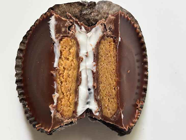 Reese's marshmallow cup cut in half showing interior.