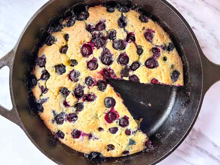 Blueberry skillet with slice out.