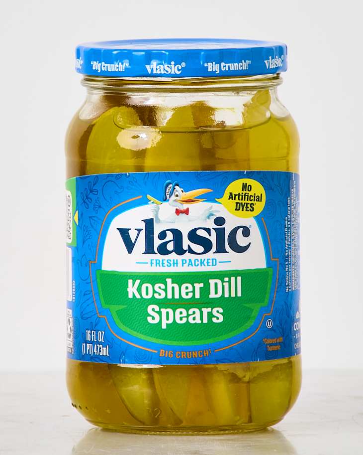 Jar of Vlasic Kosher Dill Spears pickles with a blue lid and label, showcasing the product inside.